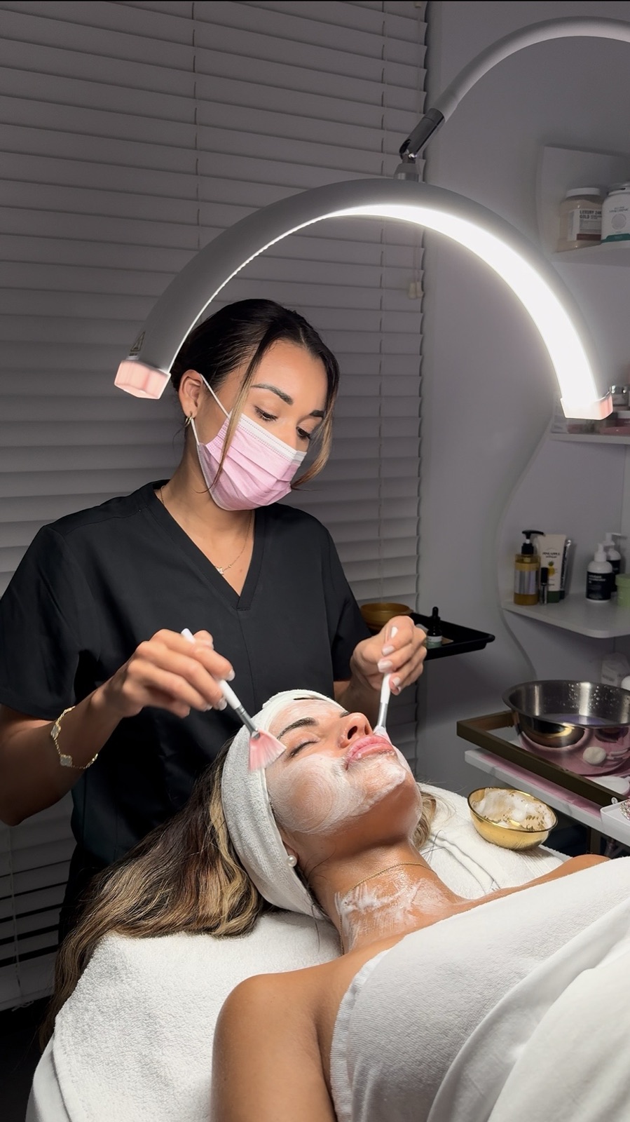 Anais Morales applying a facial mask in her Miami studio